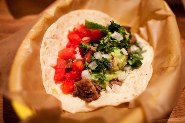A carne asada taco with grilled steak, pico, and guacamole. Customers choose between flour and corn tortillas--the latter offer the more authentic taste, says co-owner Marc Wallace. Photograph by Dakota Fine.
