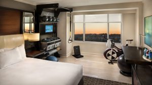 In Hilton’s New Fitness-Friendly Rooms, You Can Literally Roll Out of Bed and Into the Gym