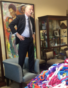 Watch Phil Mendelson Try, Try, and Try Again to Dive Into a Pile of Rainbow Leis for Pride