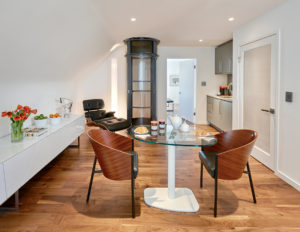 This Luxe In-Law Suite Has an Elevator That Works Like a Bank-Deposit Tube