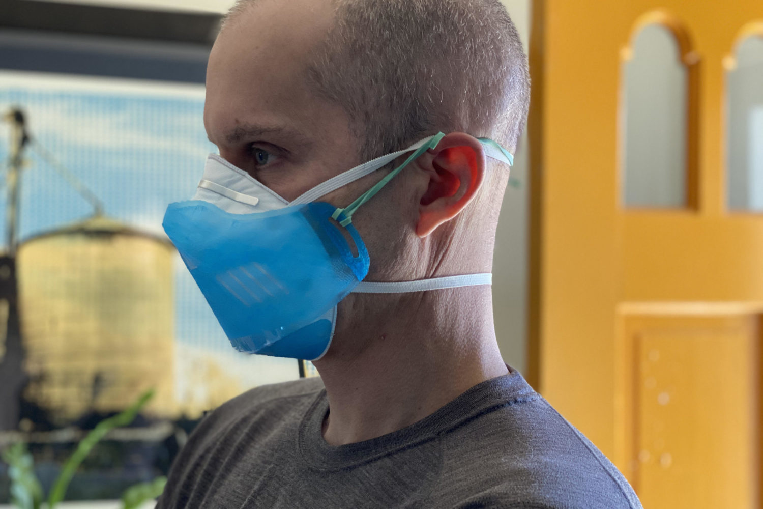 Jeremy Filko wears a 3D-printed shield over a mask. Photo courtesy of Amy and Jeremy Filko.