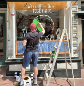 Instead of Boarding Up, Businesses Are Painting Their Storefronts With Uplifting Messages