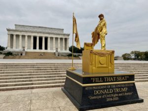 There’s a Living Statue of Trump Peeing on RBG’s Court Seat in Front of the Lincoln Memorial