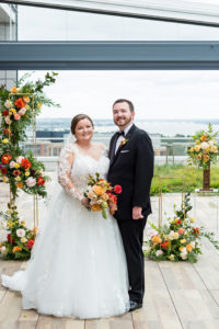An Intimate Rooftop Wedding Featuring a Peach and Orange Color Scheme at the Spy Museum
