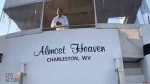 Watch Manchinema Protestors Follow Kyrsten Sinema Into a Bathroom. And Kayak to Joe Manchin’s Houseboat.