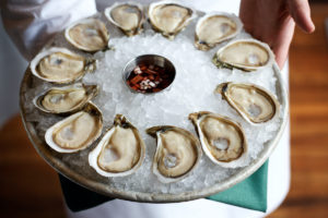 Clyde’s Restaurant Group Halts Raw Oyster Sales Following Bacterial Scare