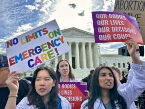 PHOTOS: Demonstrators Gather Outside the Supreme Court as It Hears Arguments on Emergency Abortion Case