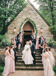 Lavish Flowers Completely Covered the 32-Foot Head Table at This Garden-Themed Wedding